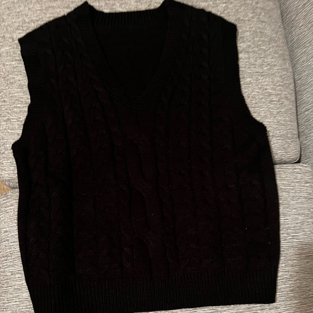 Black sleeveless sweater, V-neck